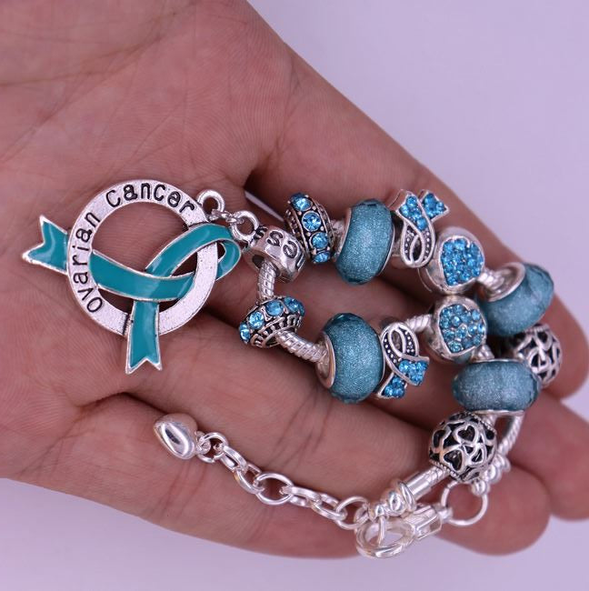 Ovarian Cancer Charm Bracelet in hand