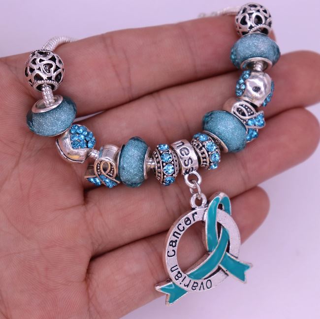 Ovarian Cancer Charm Bracelet in hand 2